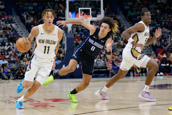 New Orleans Pelicans Dyson Daniels (11) takes Anthony Black (0) off the dribble.